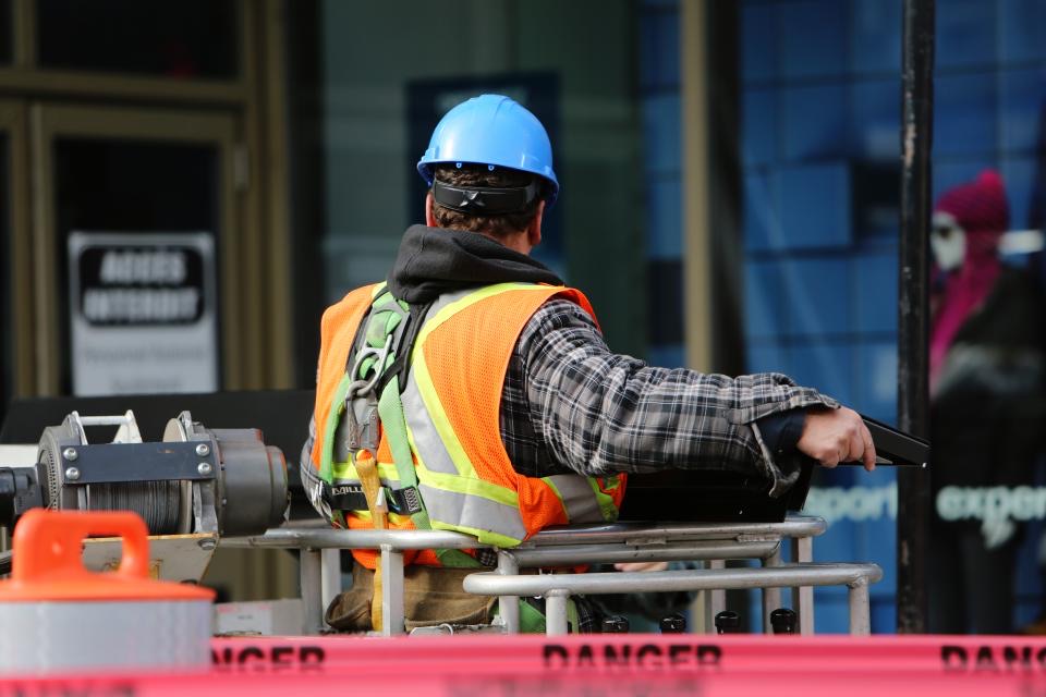 Roofing crew member on site