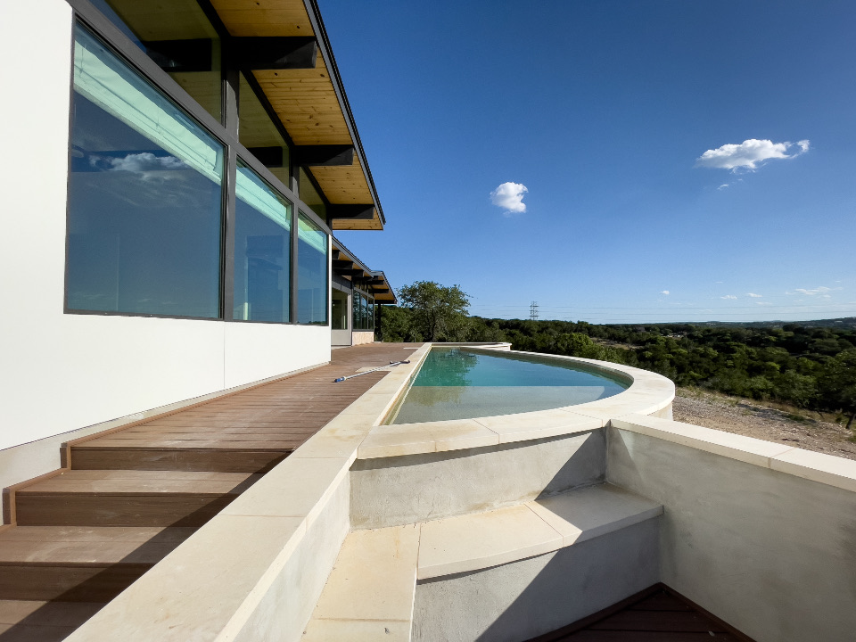 Modern home with an infinity pool overlooking the hills